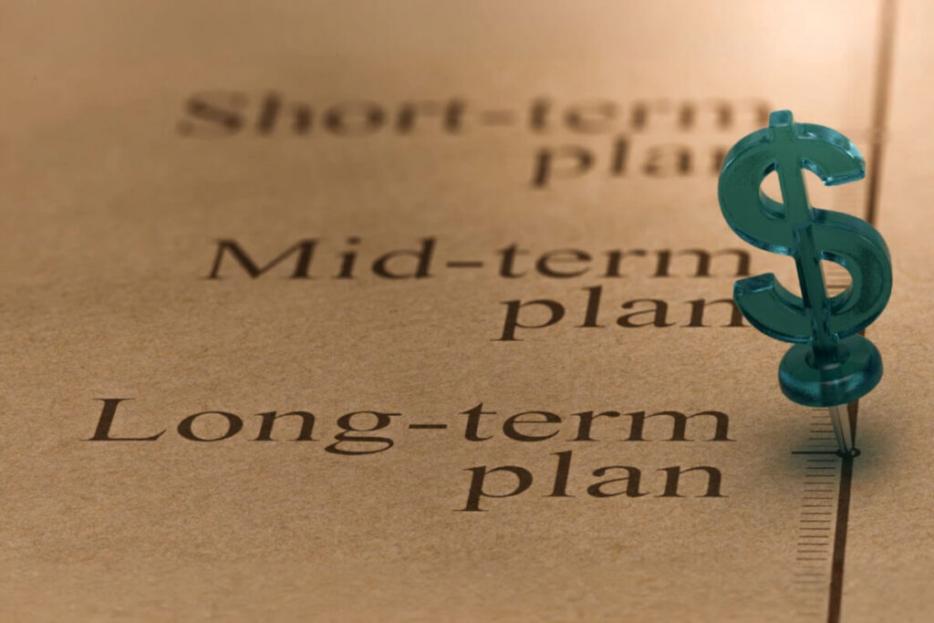 Close-up image of financial planning documents with short-term, mid-term, and long-term goals, representing budgeting, treatment planning, and long-term recovery investment.